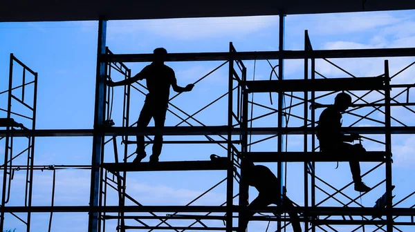 depositphotos_171264954-stock-photo-woker-silhouette-on-scaffold-contruction